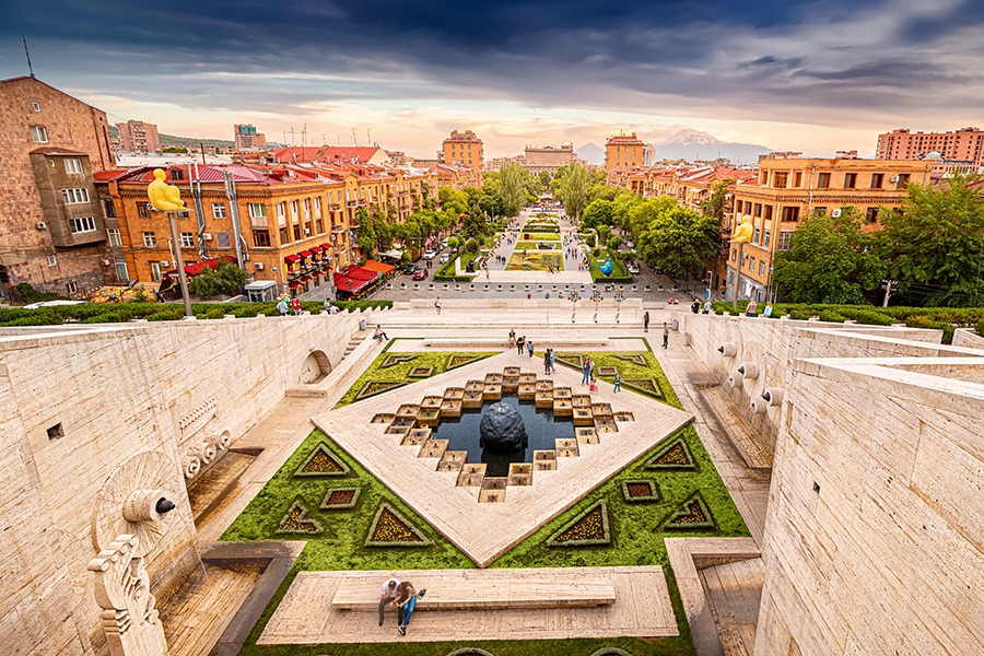 24 May 2021, Yerevan, Armenia: Scenic view from the stairs of Cascade monument to the colorful sunset over roofs of Yerevan city and symbol of Armenia - Mount Ararat